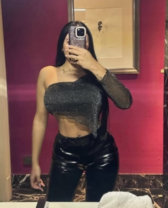 Busty Latino Brunette, Waiting For You! backdrop